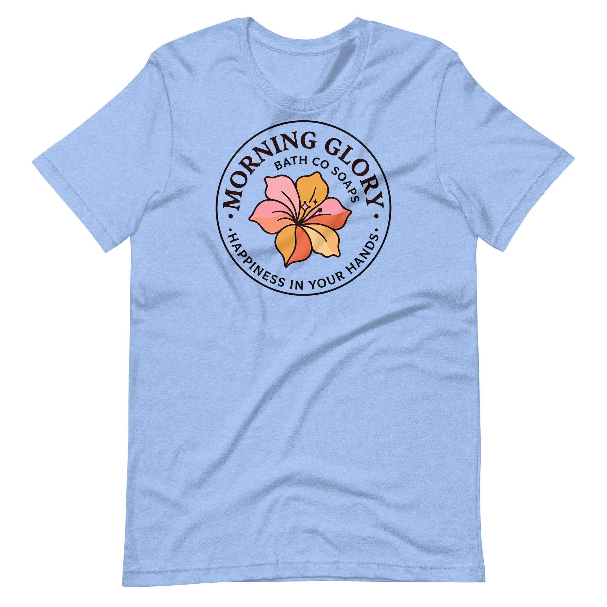A heather Caroline blue Morning Glory Bath Co t-shirt featuring the circular 'Happiness in Your Hands' floral logo against a plain white background