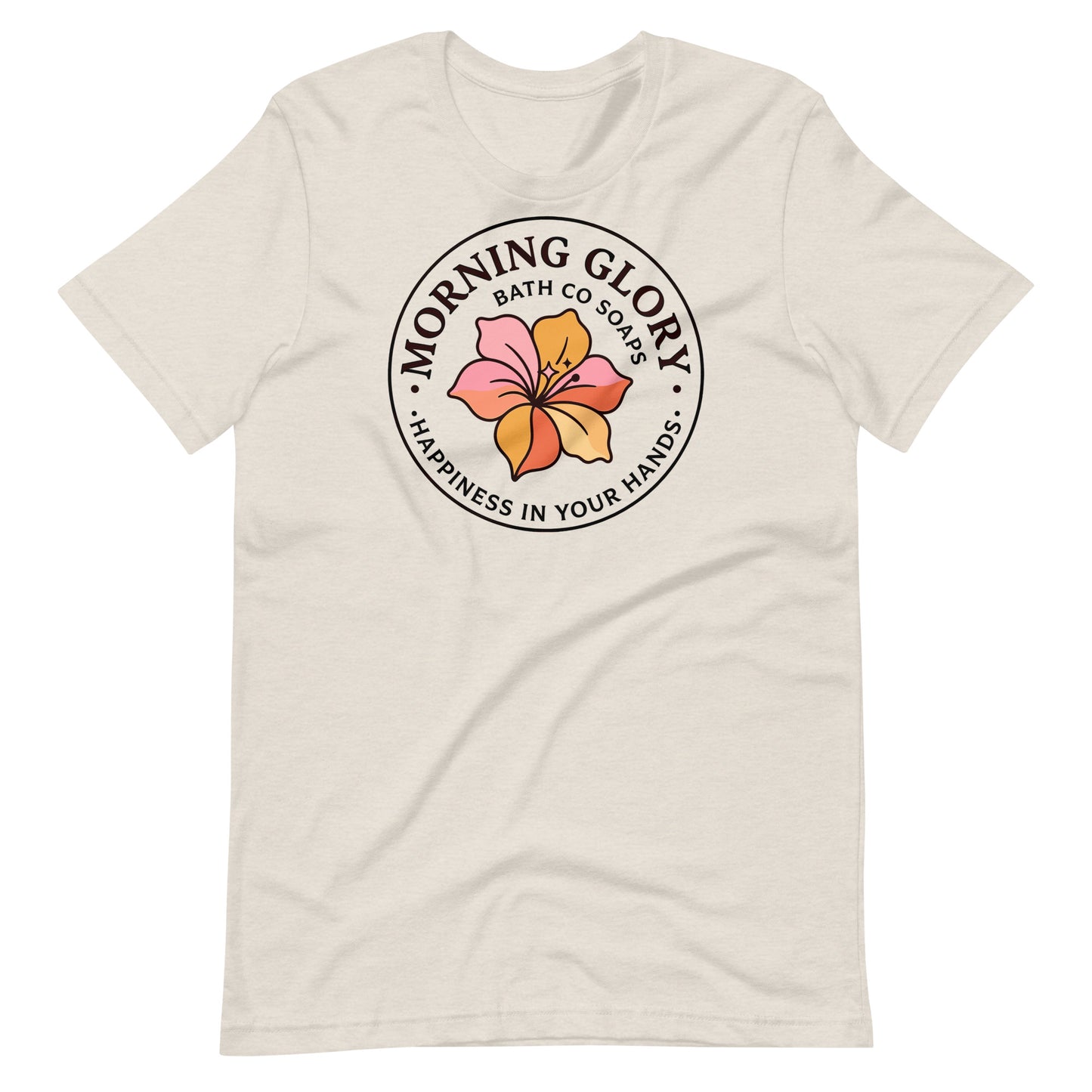 A heather dust Morning Glory Bath Co t-shirt featuring the circular 'Happiness in Your Hands' floral logo against a plain white background