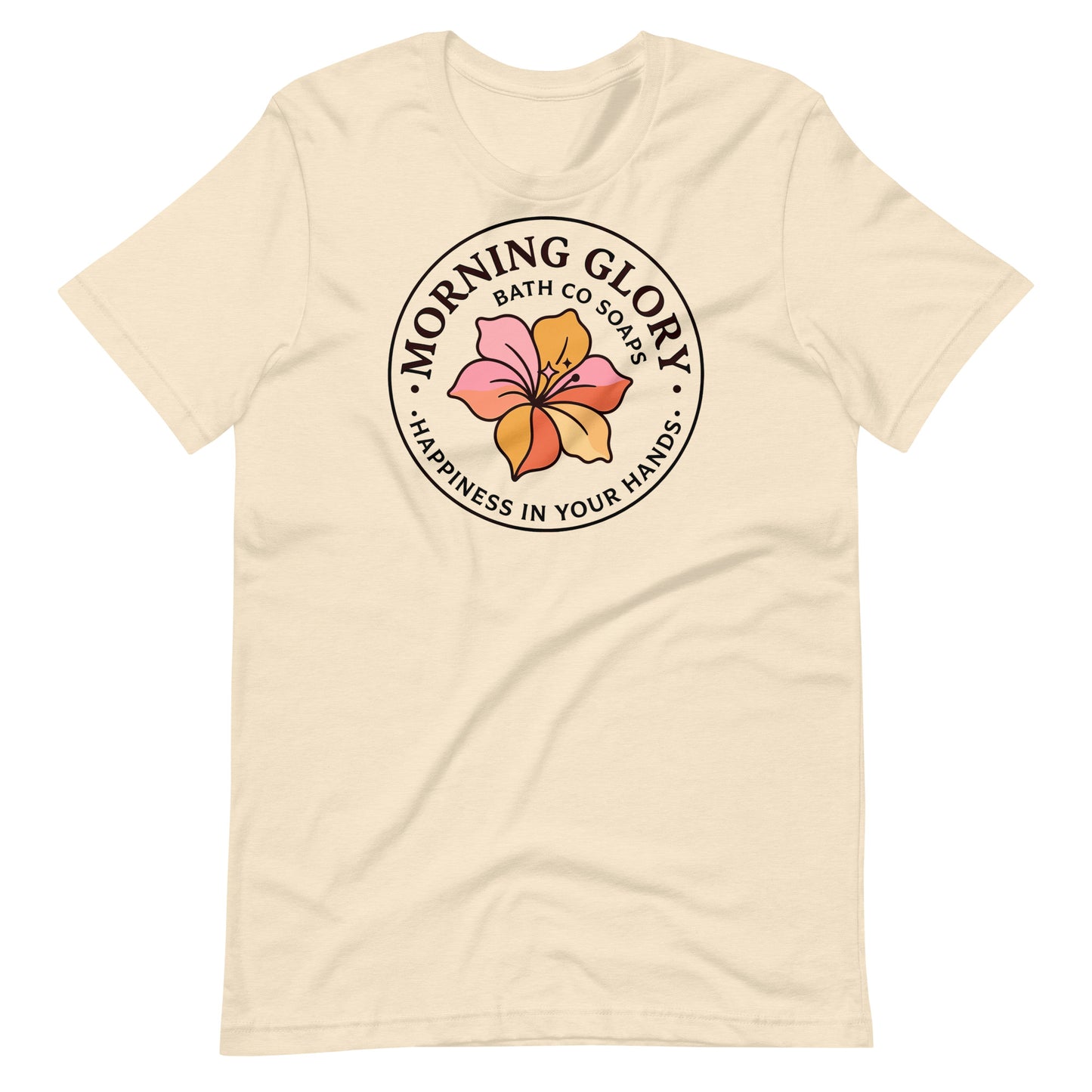 A heather natural Morning Glory Bath Co t-shirt featuring the circular 'Happiness in Your Hands' floral logo against a plain white background