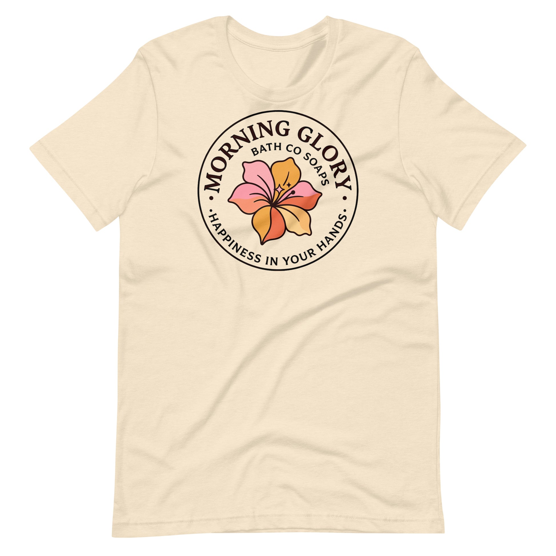 A heather natural Morning Glory Bath Co t-shirt featuring the circular 'Happiness in Your Hands' floral logo against a plain white background