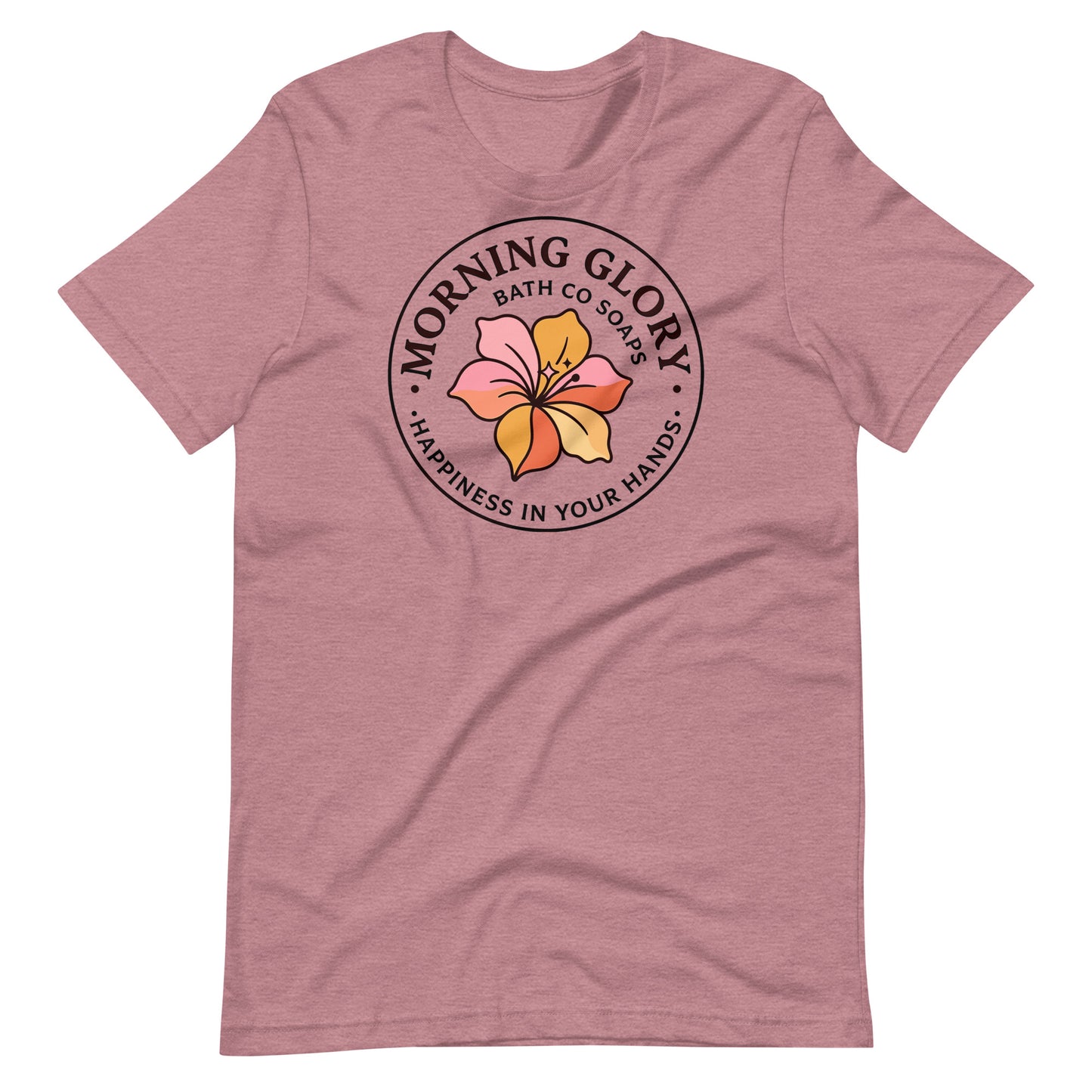 A heather orchid Morning Glory Bath Co t-shirt featuring the circular 'Happiness in Your Hands' floral logo against a plain white background