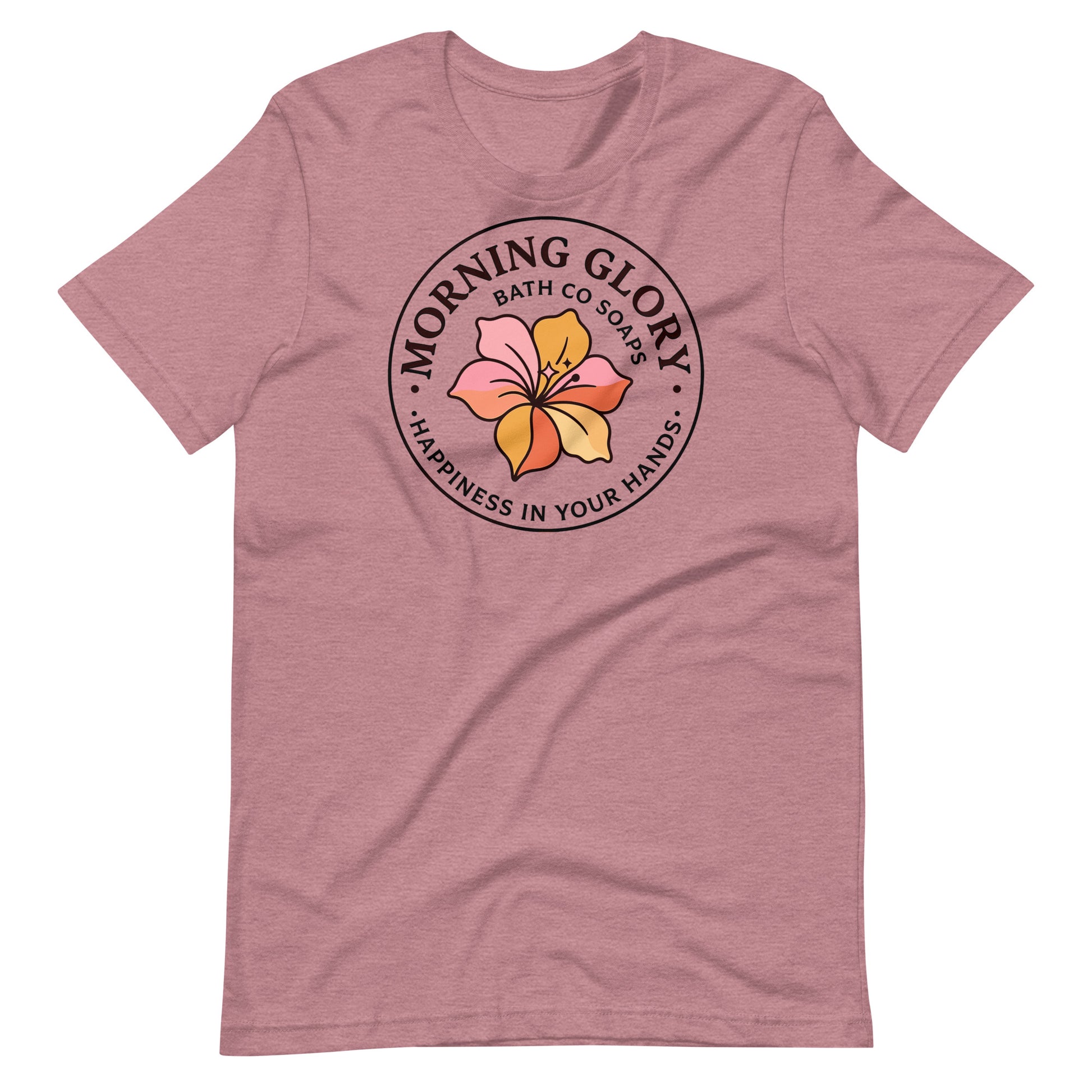 A heather orchid Morning Glory Bath Co t-shirt featuring the circular 'Happiness in Your Hands' floral logo against a plain white background