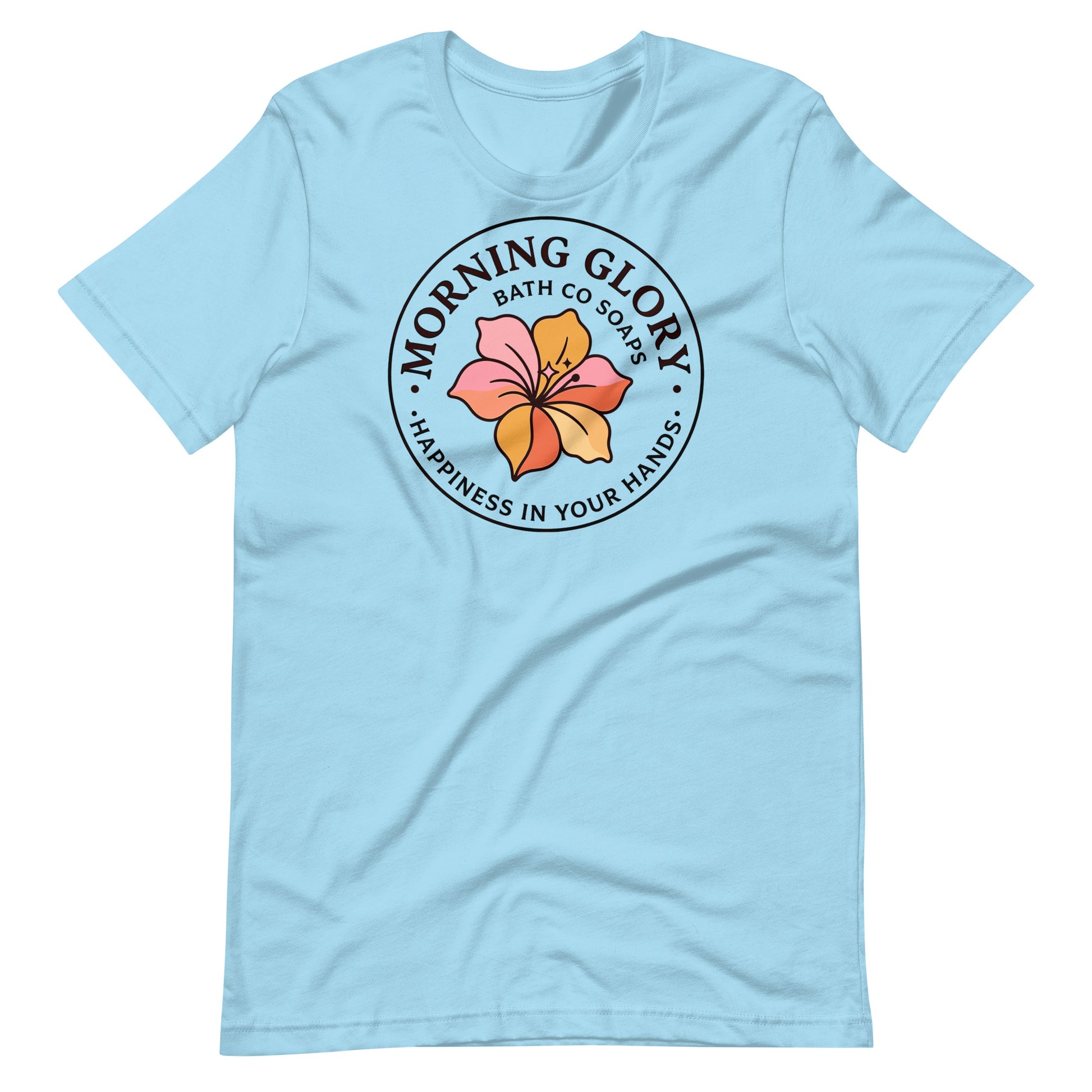 A ocean blue Morning Glory Bath Co t-shirt featuring the circular 'Happiness in Your Hands' floral logo against a plain white background